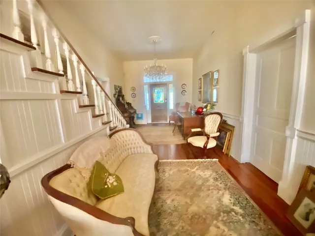 a view of a livingroom with furniture and a window