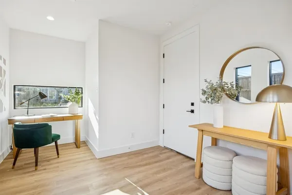 a view of living room with furniture and a window