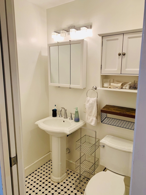 1 Unity Street, Unit 4R Boston, MA 02113 - Photo 11 of 13 a bathroom with a sink toilet and shower