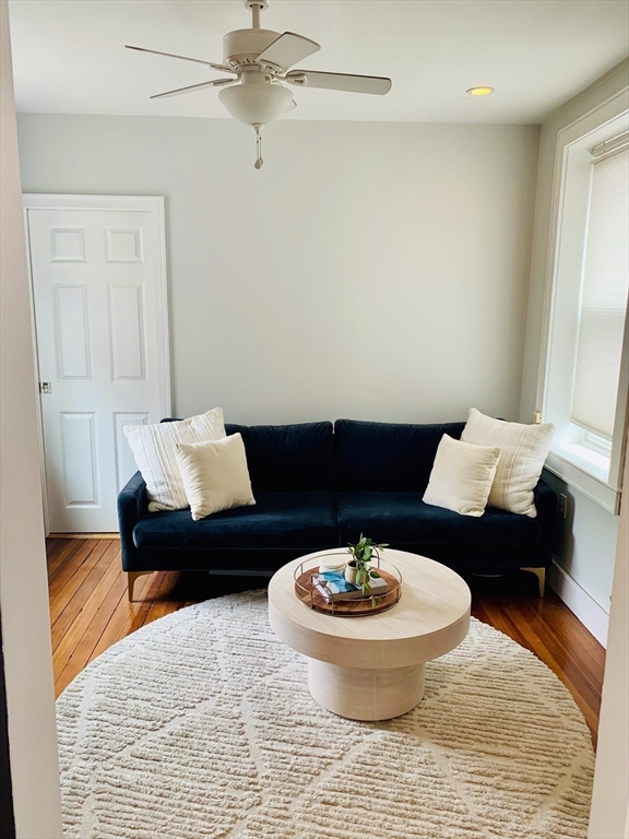 1 Unity Street, Unit 4R Boston, MA 02113 - Photo 5 of 13 a living room with furniture and a rug