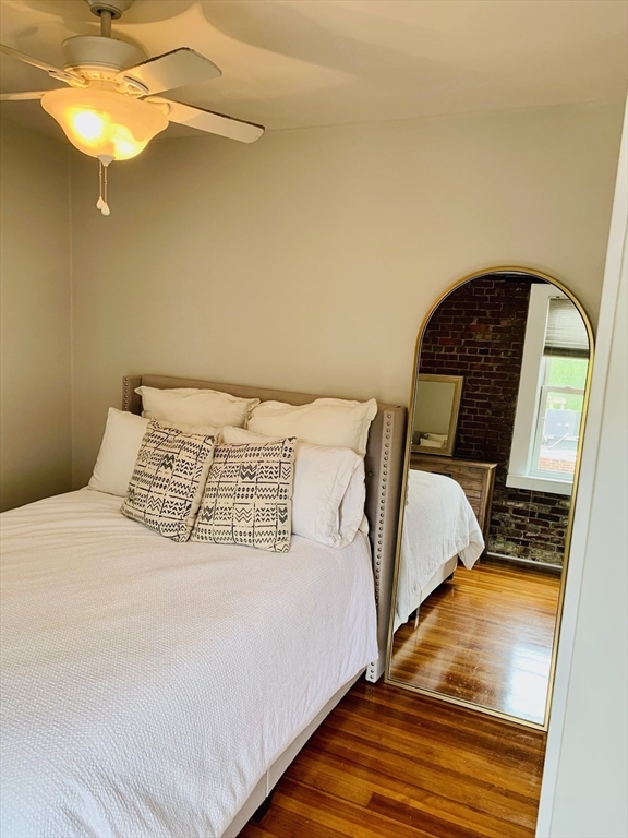 1 Unity Street, Unit 4R Boston, MA 02113 - Photo 8 of 13 a bedroom with a bed and a mirror