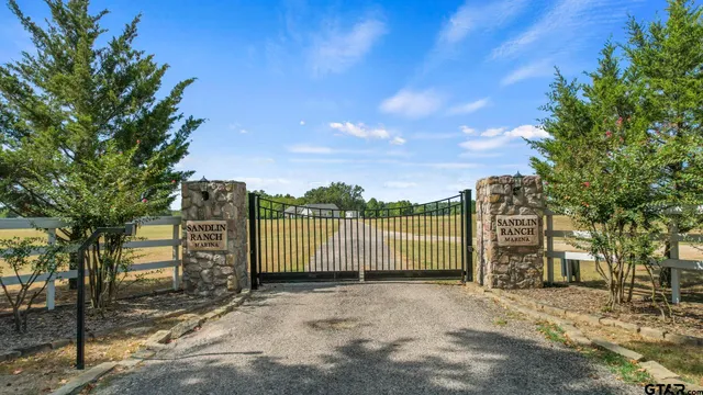a view of a street with a trees in the background