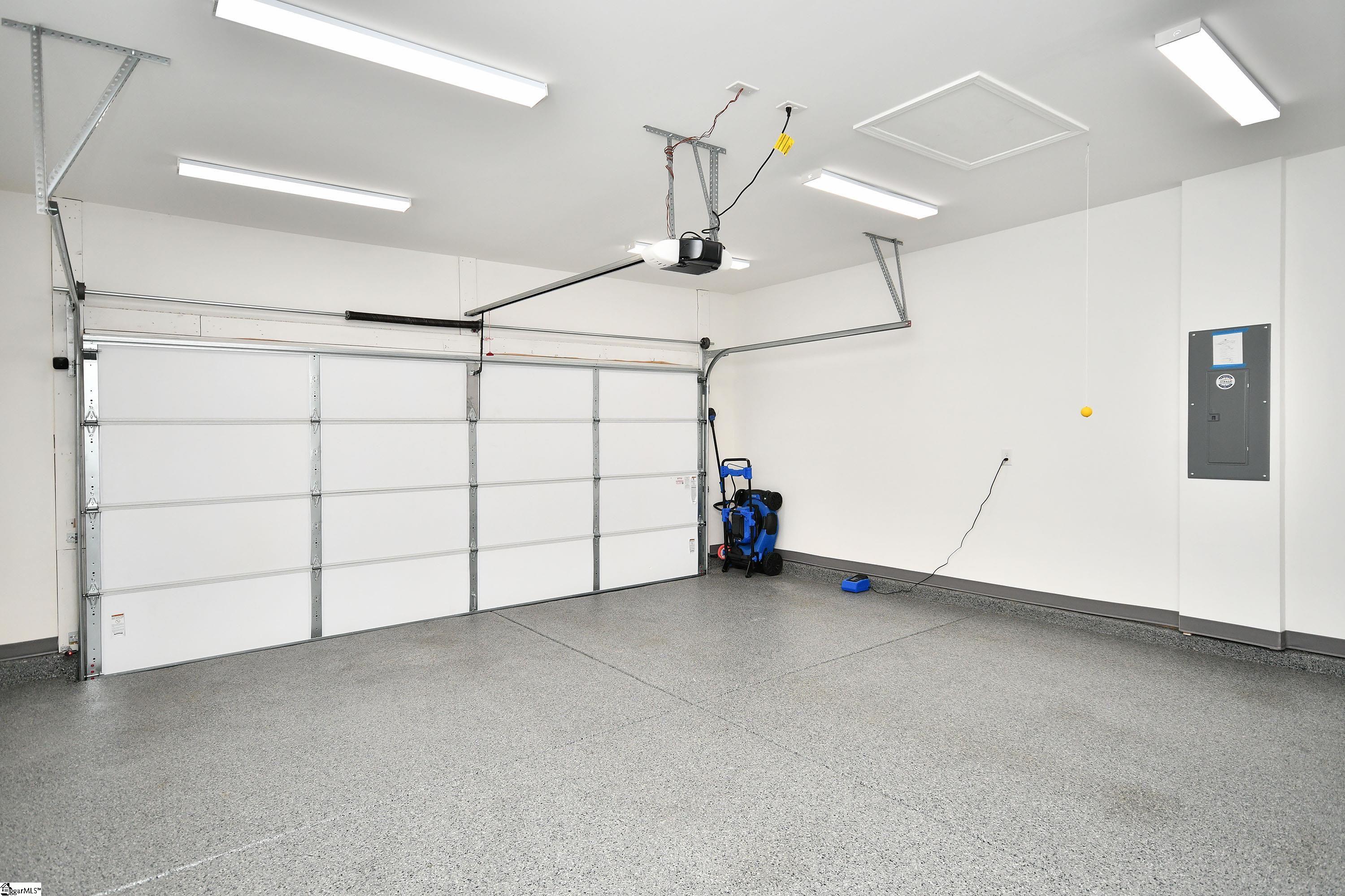 617 Columbus Circle Simpsonville, SC 29680 - Photo 26 of 28 Polyurea coated floor, shop lights, insulated garage door