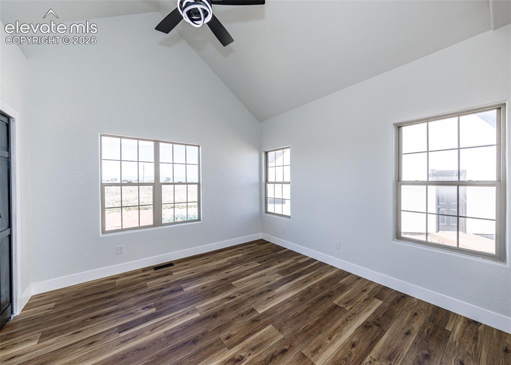 1120 Newton Road Pueblo, CO 81005 - Photo 18 of 46 a view of empty room with wooden floor and window