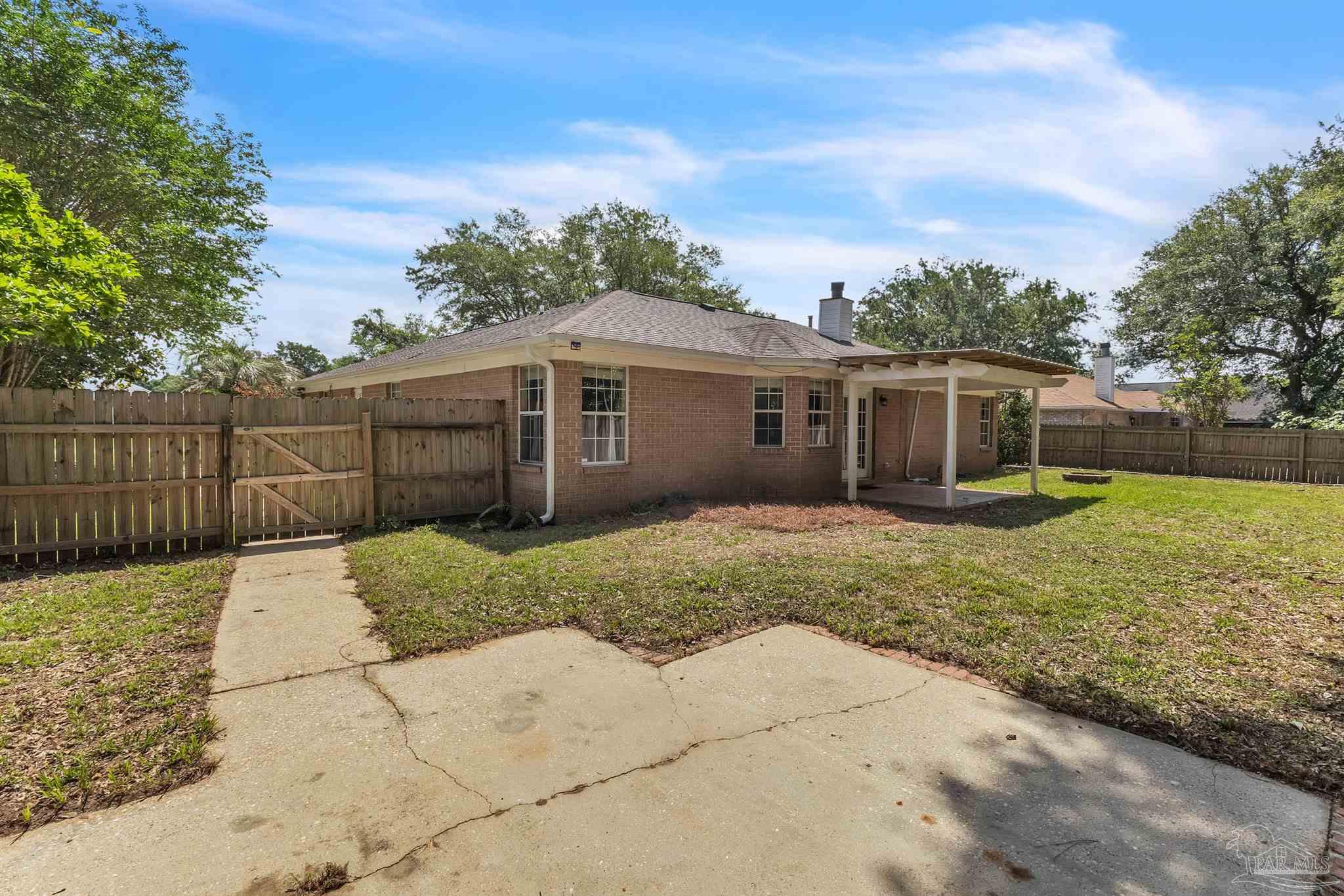 4321 Ridgeland Drive Pace, FL 32571 - Photo 33 of 36 a view of a house with a yard