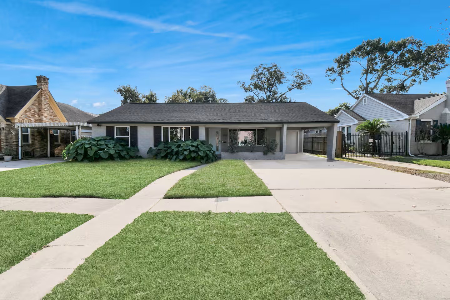 3318 Wichita Street Houston, TX 77004 - Photo 1 of 36 a front view of a house with a yard