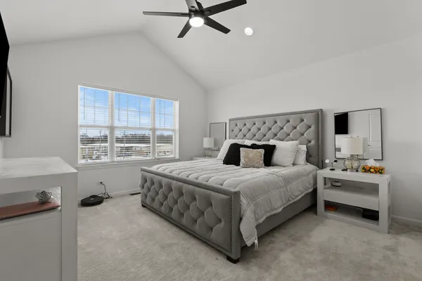 a bedroom with a bed and window