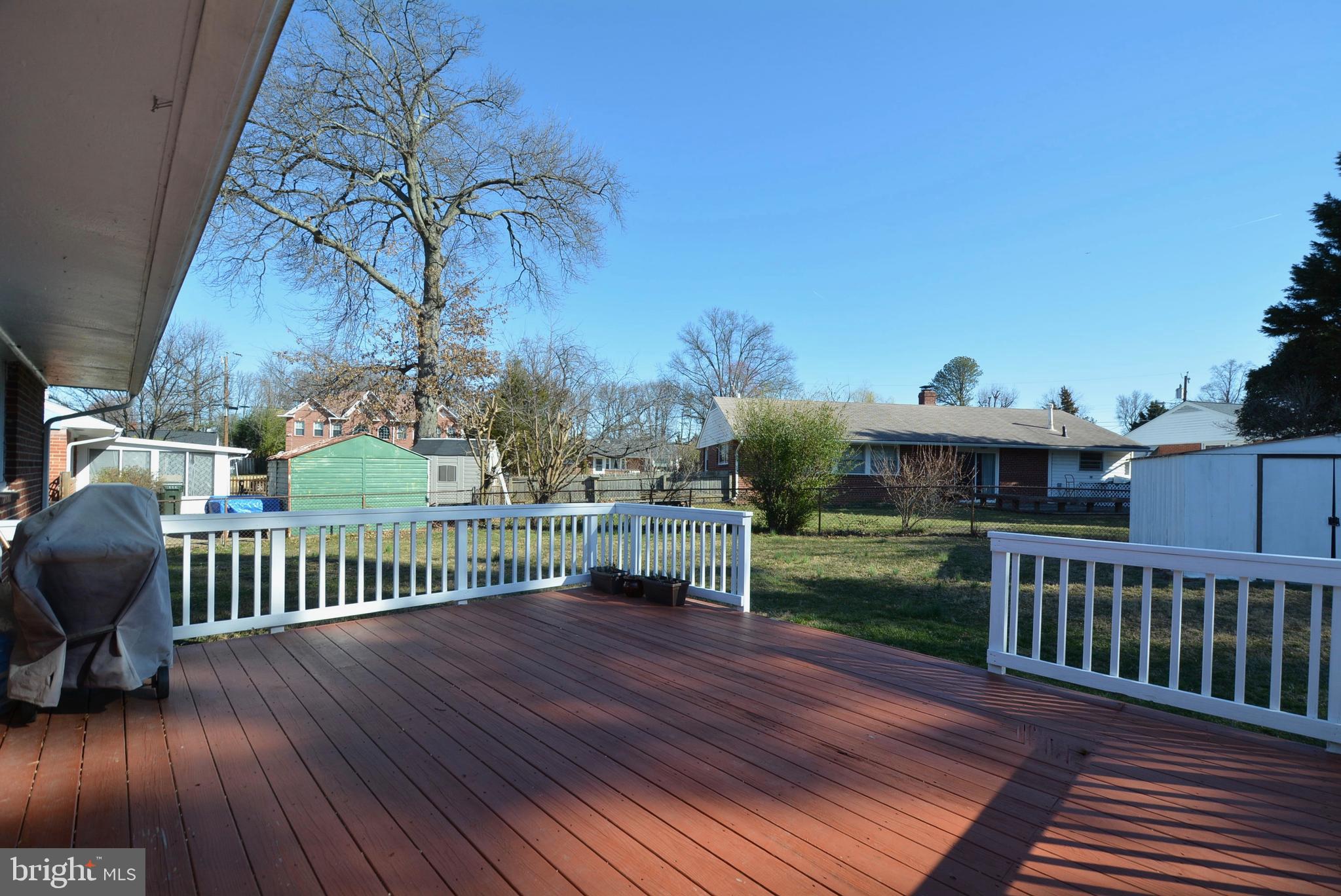 4609 Backlick Road Annandale, VA 22003 - Photo 33 of 38 Backyard deck with step down and fenced yard