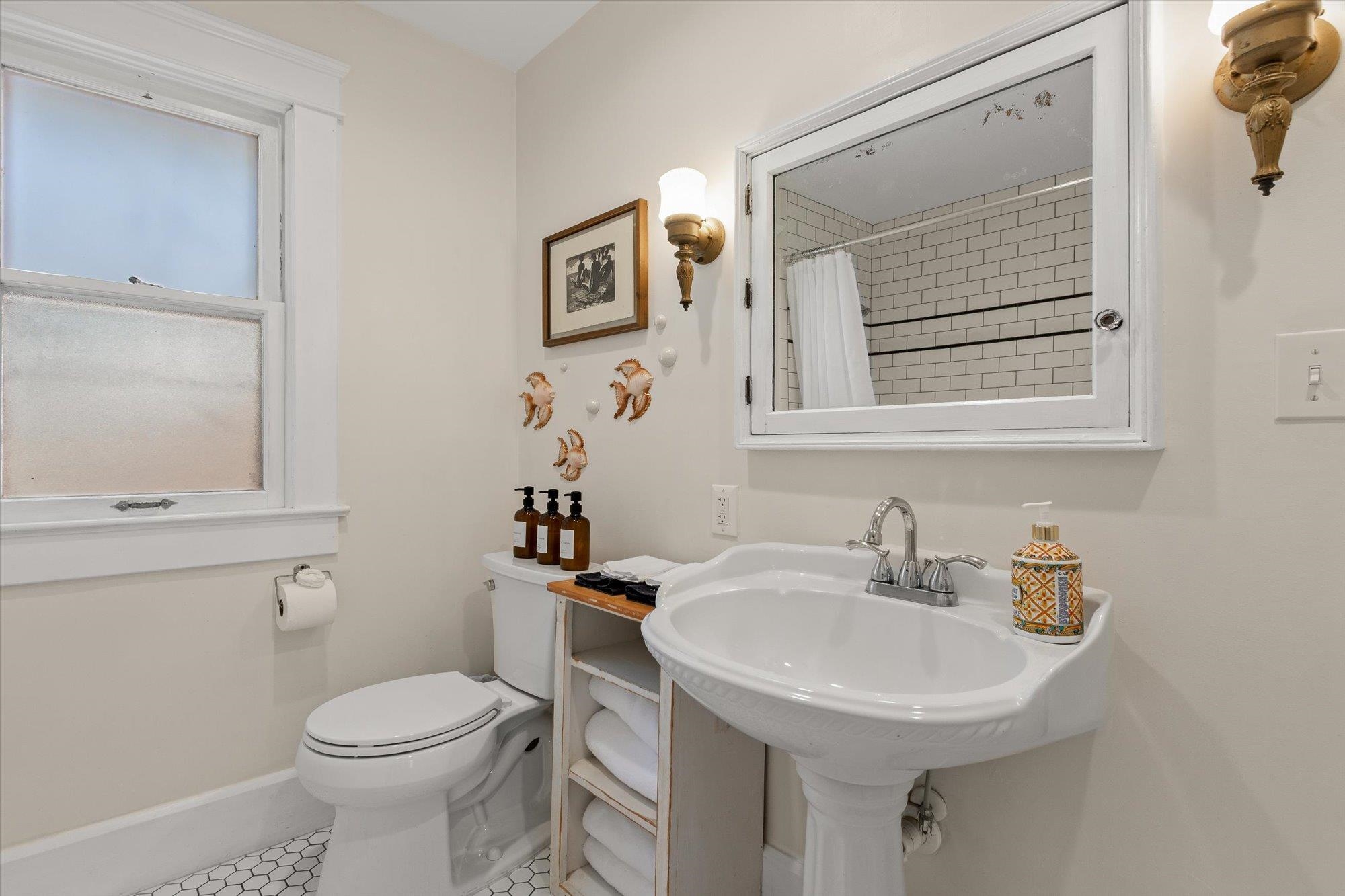 16 Locust Street St. Augustine, FL 32084 - Photo 13 of 76 Full bathroom featuring tile patterned flooring and a shower with curtain