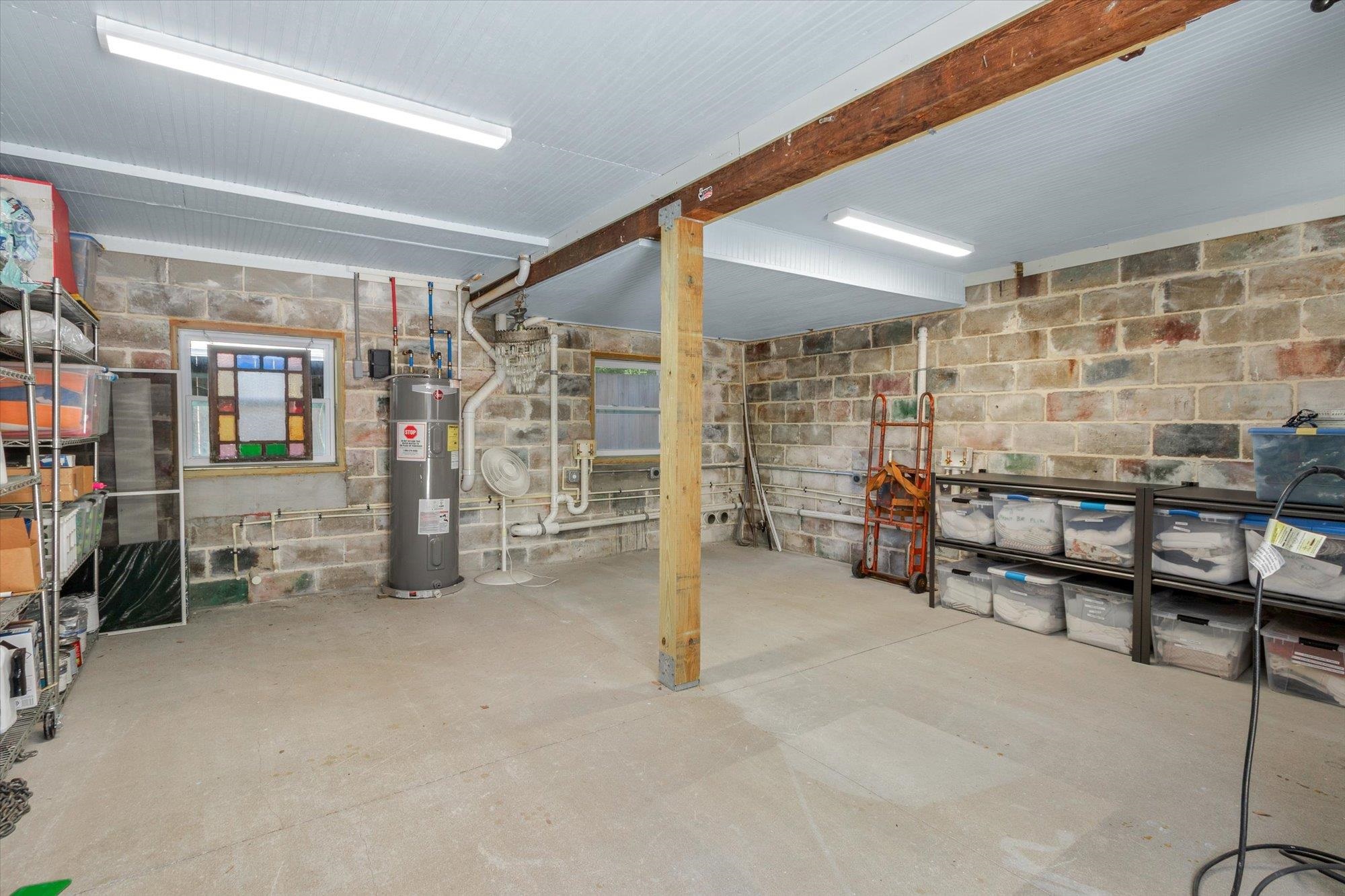 16 Locust Street St. Augustine, FL 32084 - Photo 16 of 76 Basement with concrete block wall and water heater