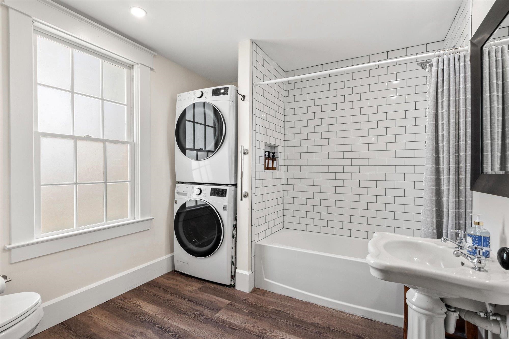 16 Locust Street St. Augustine, FL 32084 - Photo 19 of 75 a bathroom with a sink a bathtub and a shower