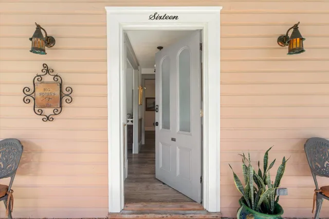 a bathroom with a double vanity sink a mirror and a bathtub