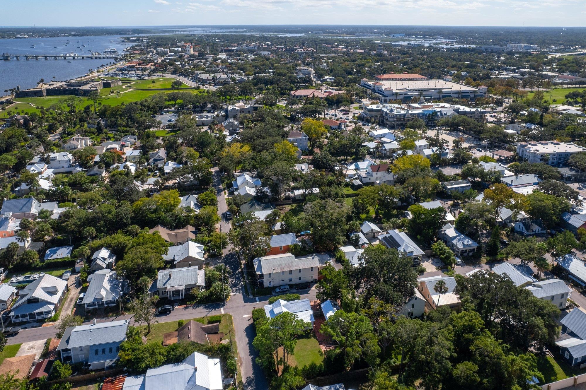 16 Locust Street St. Augustine, FL 32084 - Photo 27 of 76 Aerial view of property and surrounding area featuring nearby suburban area, a nearby body of water, and a notable bridge