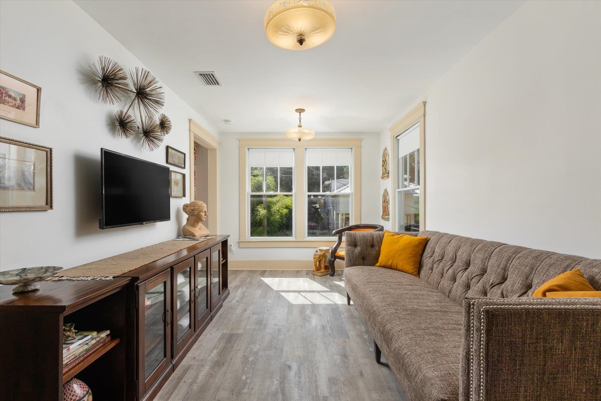 16 Locust Street St. Augustine, FL 32084 - Photo 3 of 76 Living area featuring light wood finished floors and baseboards