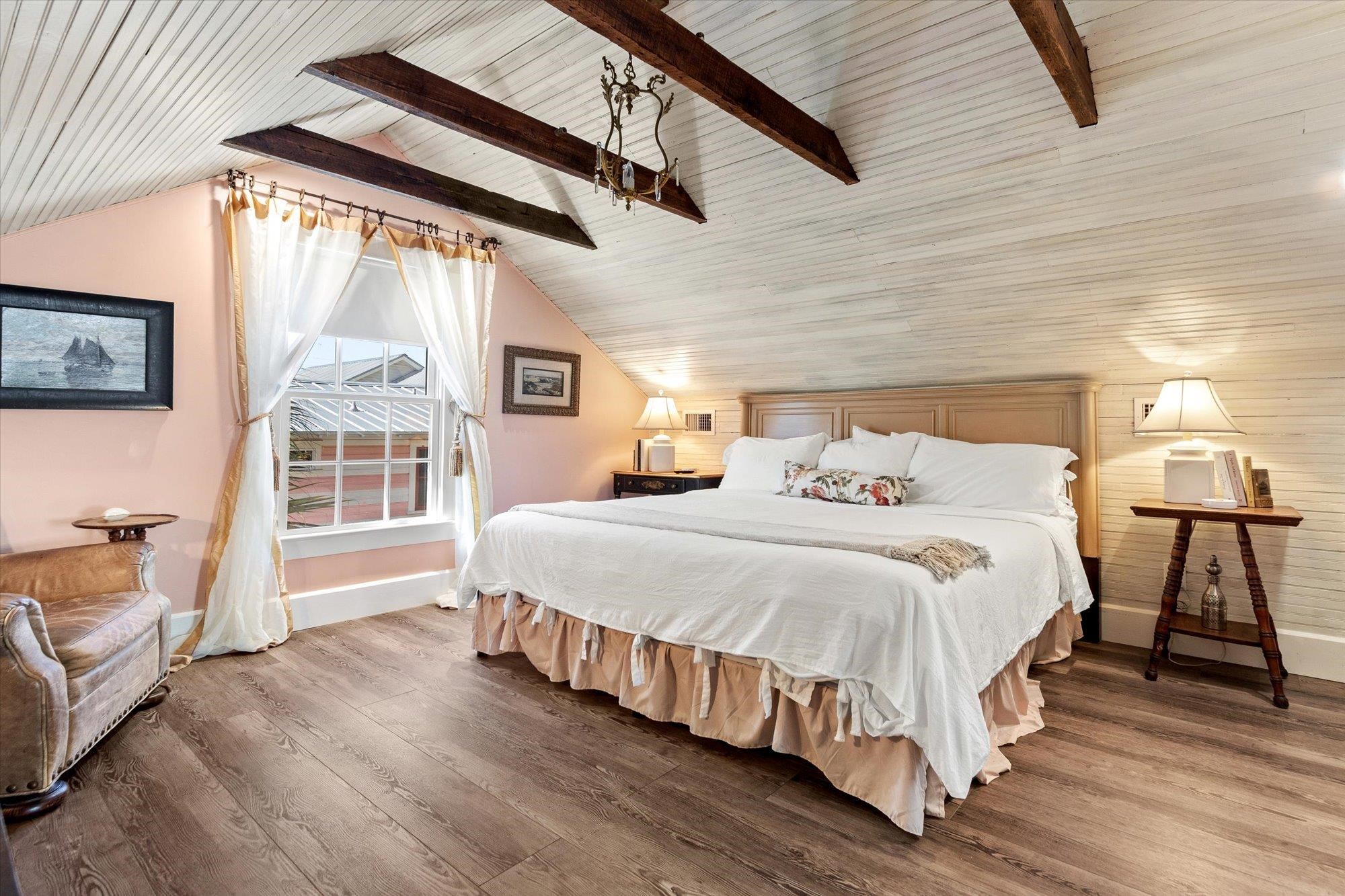 16 Locust Street St. Augustine, FL 32084 - Photo 3 of 75 a bedroom with a bed next to a window with outer view