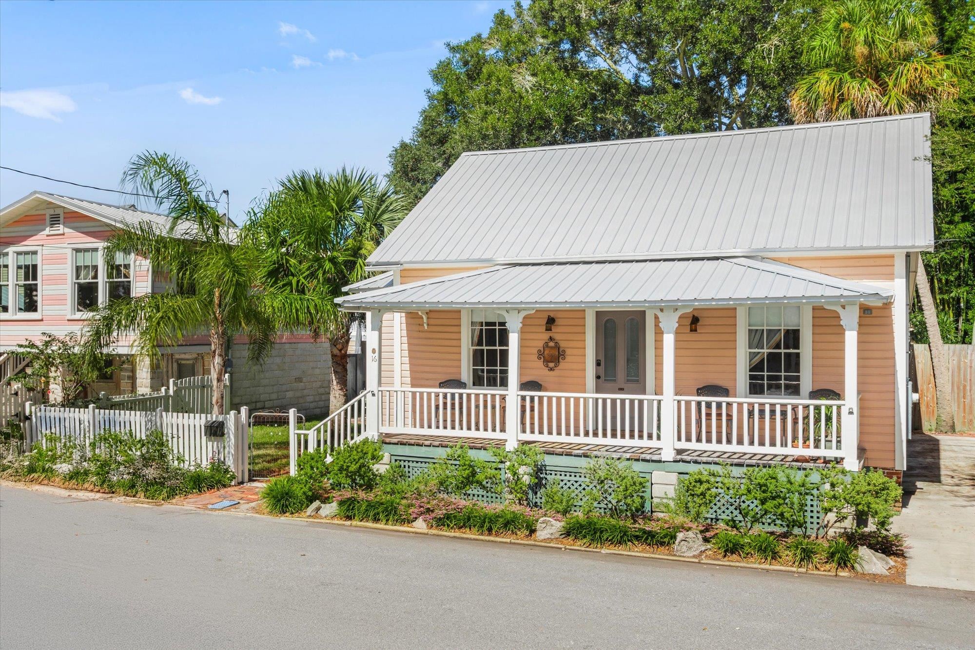16 Locust Street St. Augustine, FL 32084 - Photo 32 of 75 View of front facade with covered porch and a metal roof