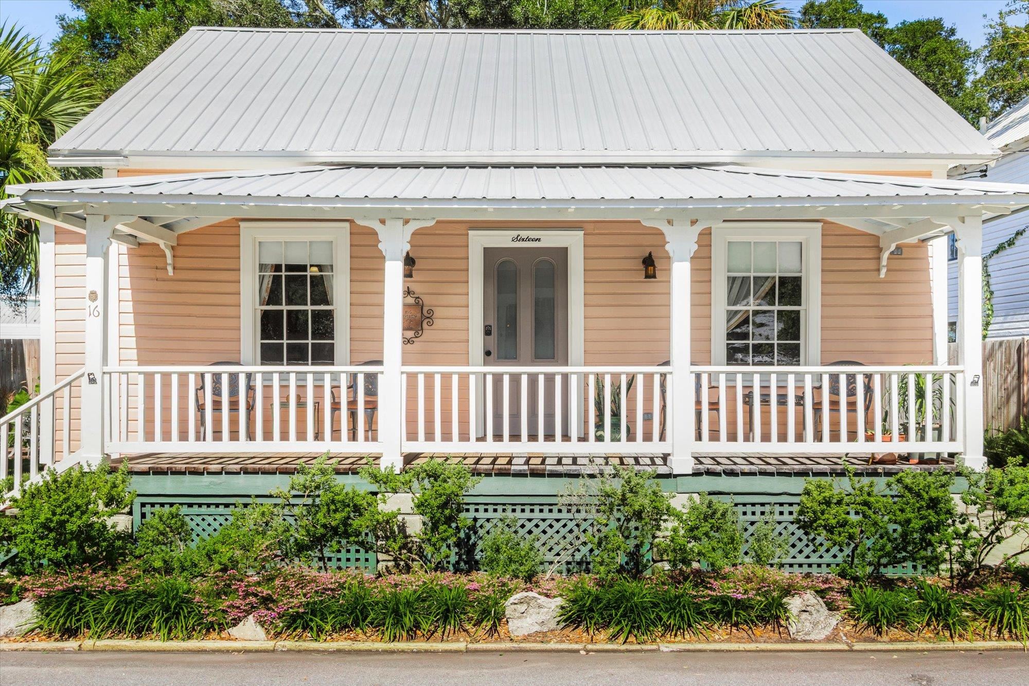 16 Locust Street St. Augustine, FL 32084 - Photo 33 of 75 View of front facade featuring covered porch and a metal roof