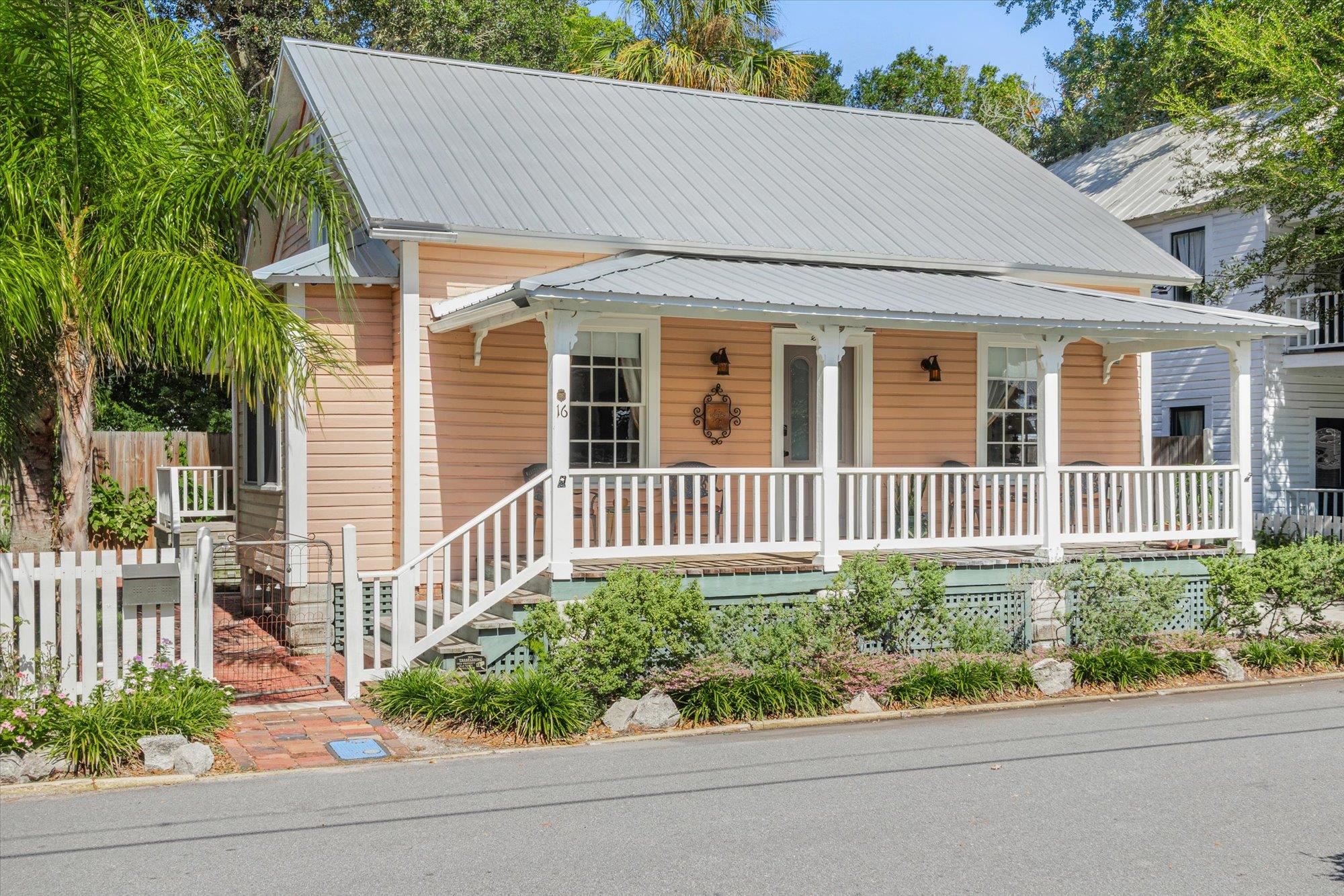 16 Locust Street St. Augustine, FL 32084 - Photo 34 of 75 View of front of house featuring a porch and a metal roof