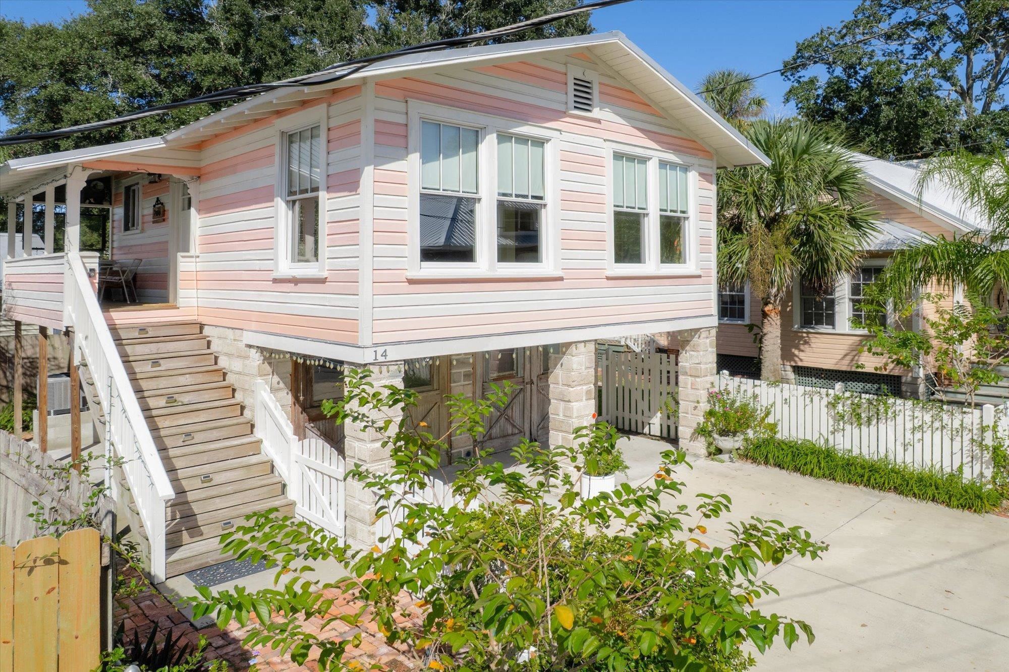 16 Locust Street St. Augustine, FL 32084 - Photo 43 of 75 a front view of a house with a garden