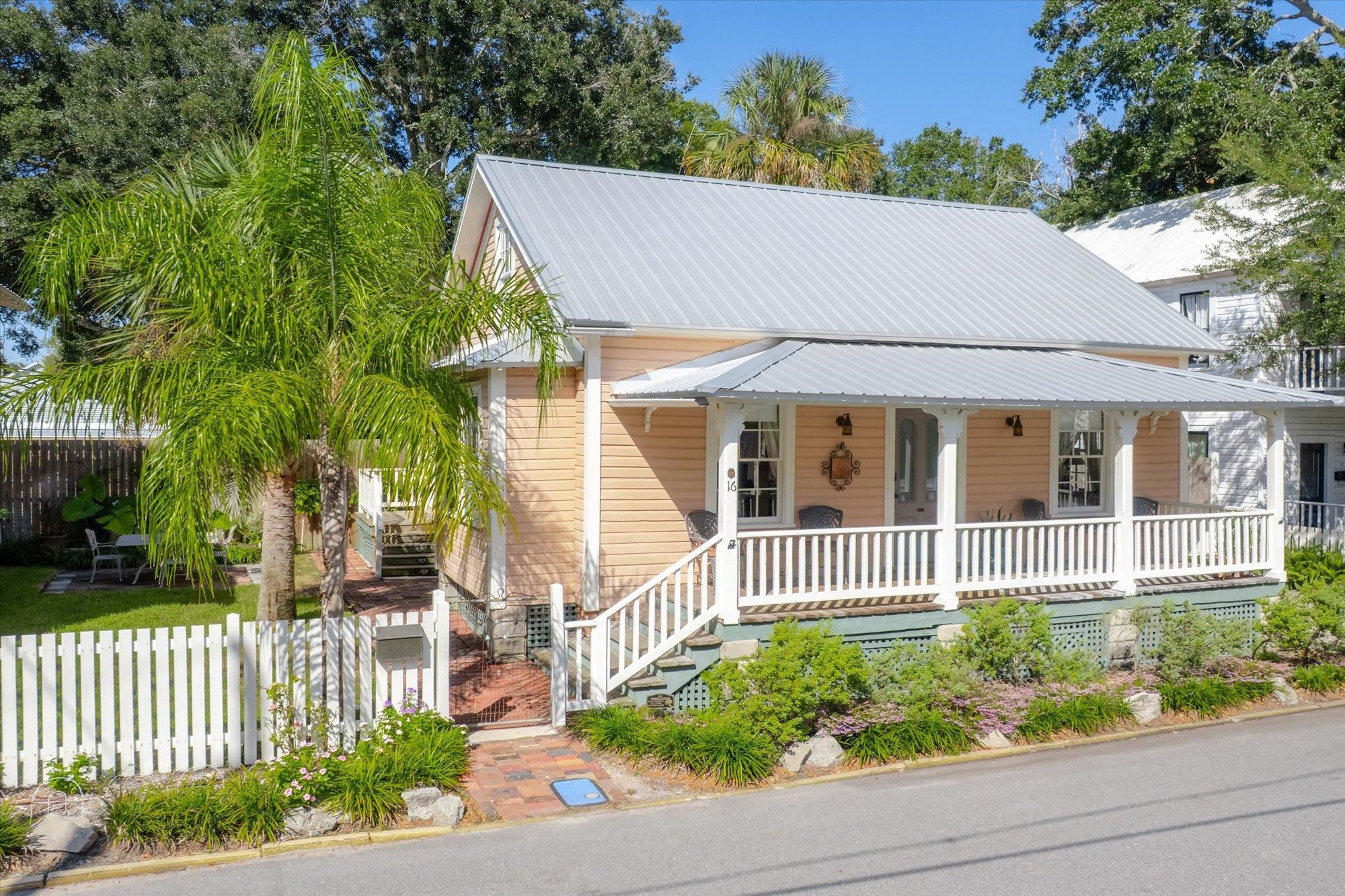 16 Locust Street St. Augustine, FL 32084 - Photo 45 of 75 a house view with a garden space