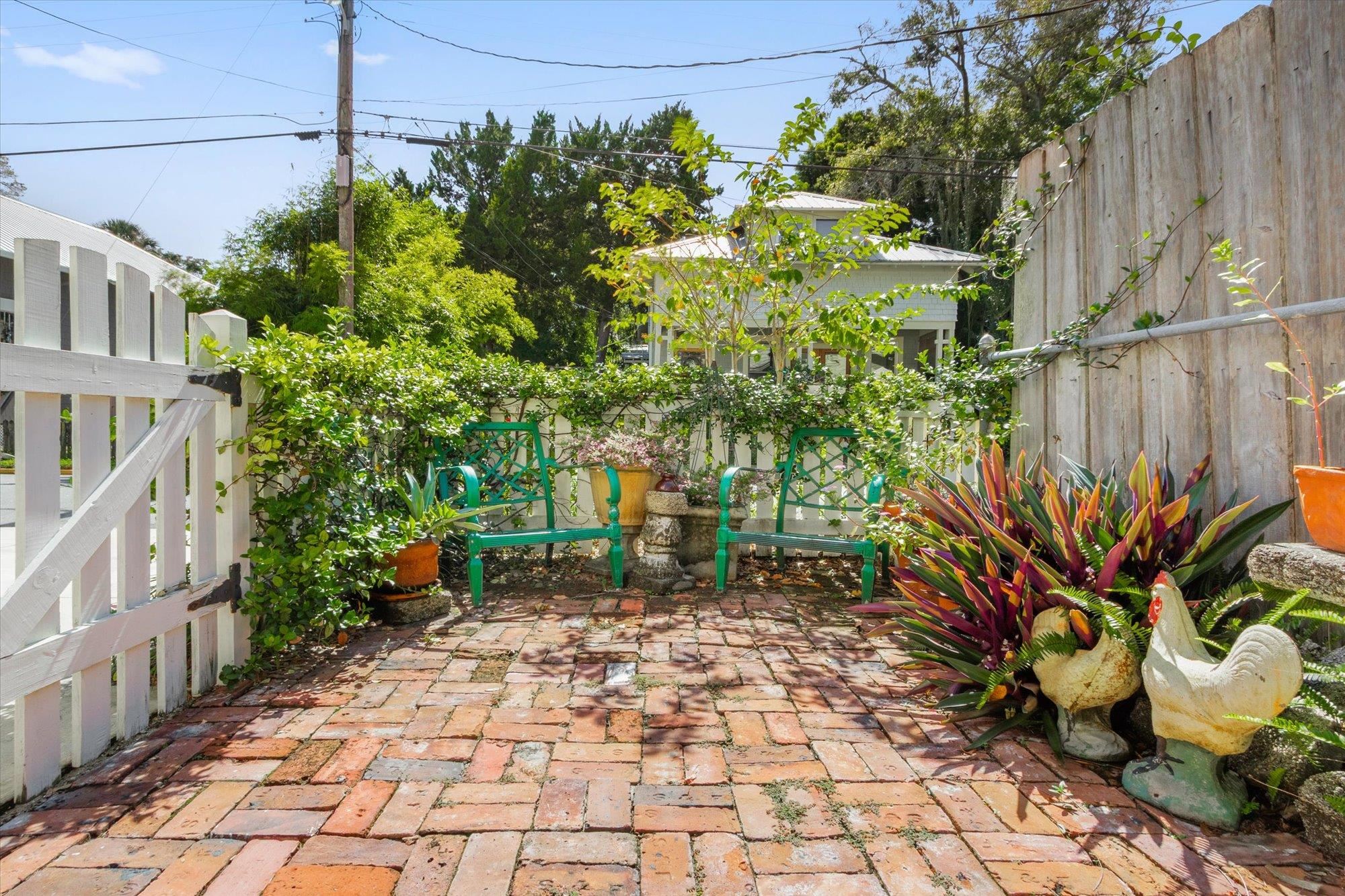 16 Locust Street St. Augustine, FL 32084 - Photo 48 of 75 a backyard of a house with lots of green space