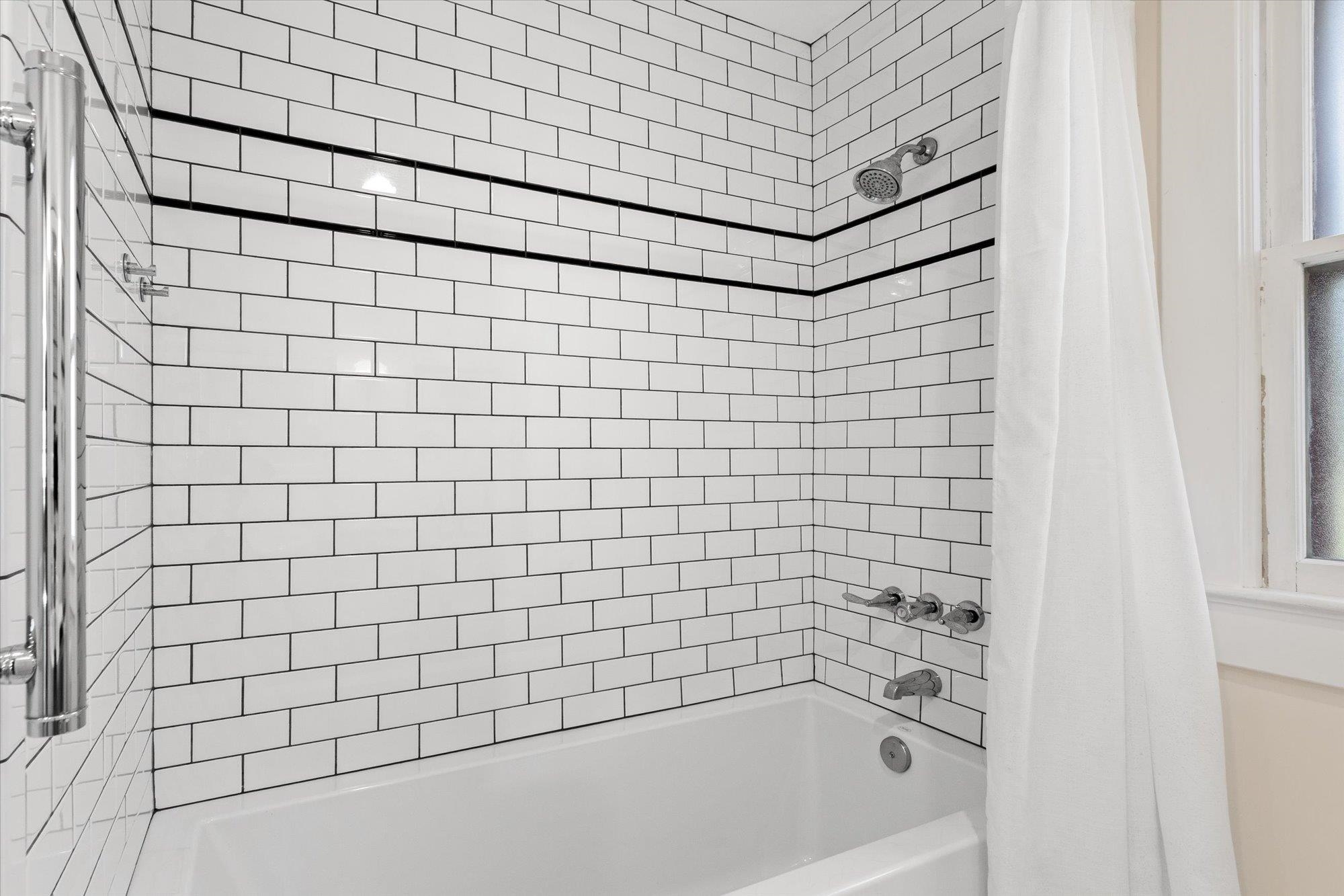 16 Locust Street St. Augustine, FL 32084 - Photo 55 of 75 a bathroom with a bathtub and shower