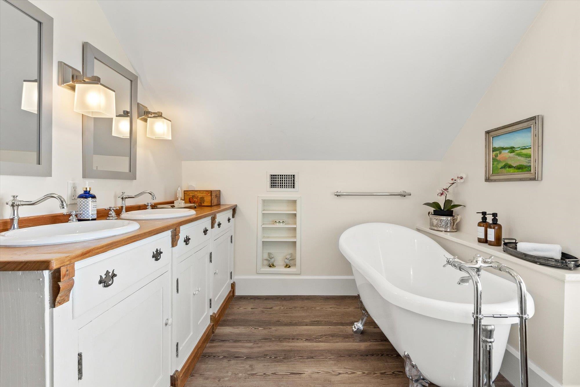 16 Locust Street St. Augustine, FL 32084 - Photo 6 of 75 a bathroom with a double vanity sink a mirror and a bathtub