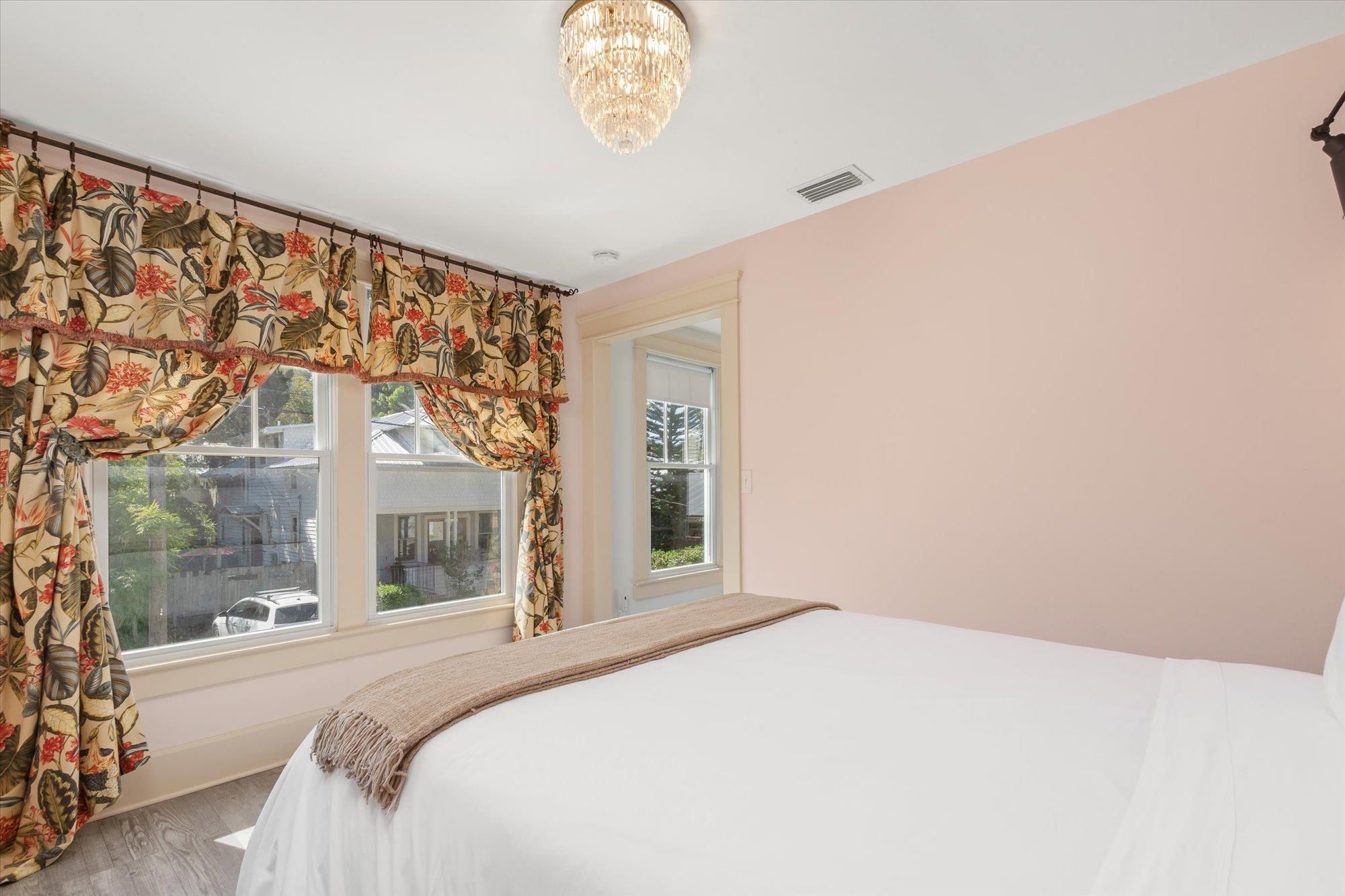 16 Locust Street St. Augustine, FL 32084 - Photo 62 of 75 a bedroom with a large bed and a large window