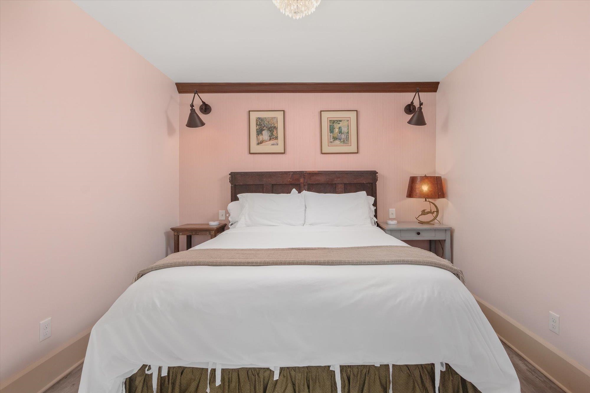 16 Locust Street St. Augustine, FL 32084 - Photo 63 of 75 a bedroom with a bed and a lamp