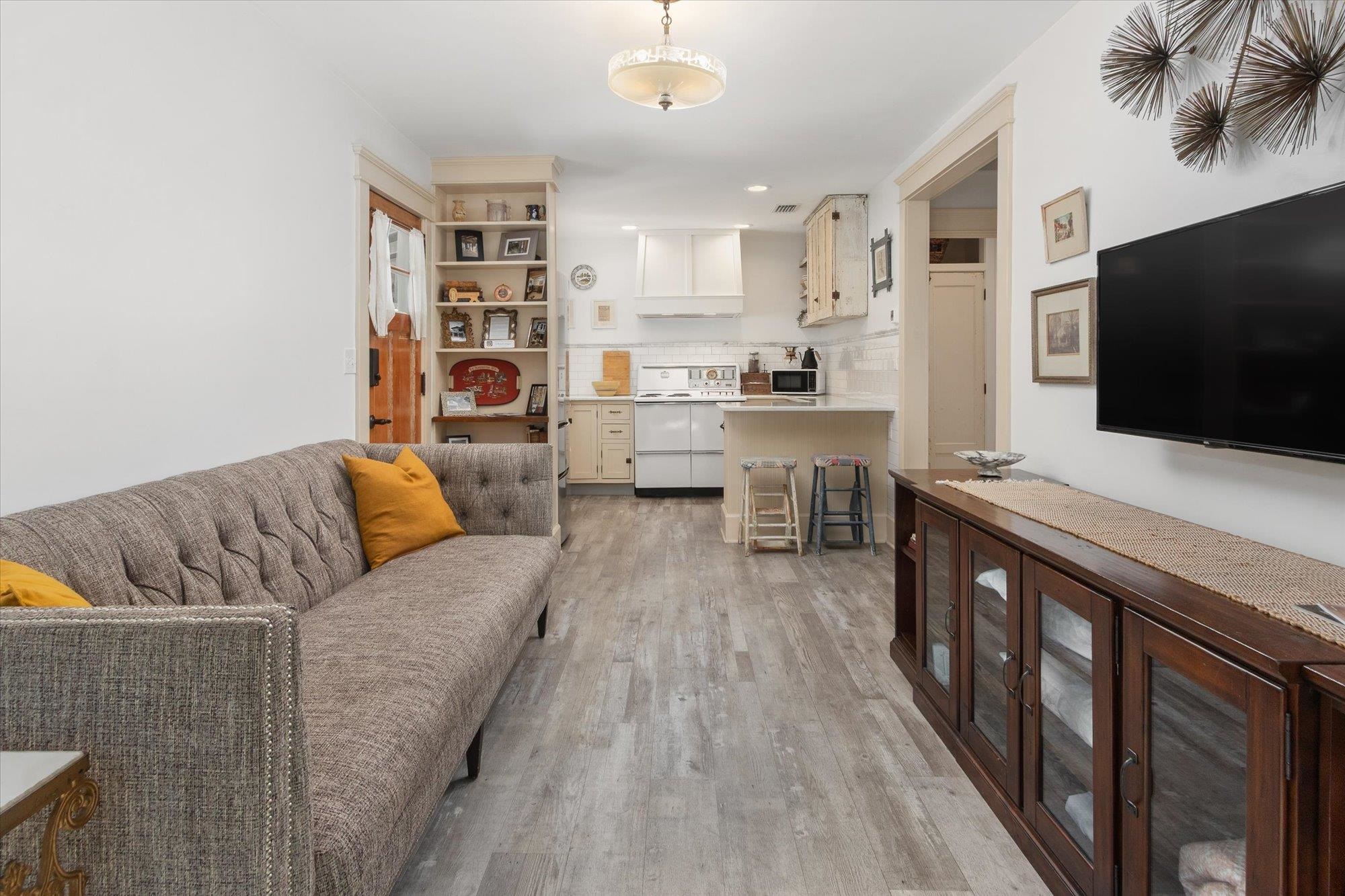 16 Locust Street St. Augustine, FL 32084 - Photo 65 of 75 a living room with furniture and a flat screen tv
