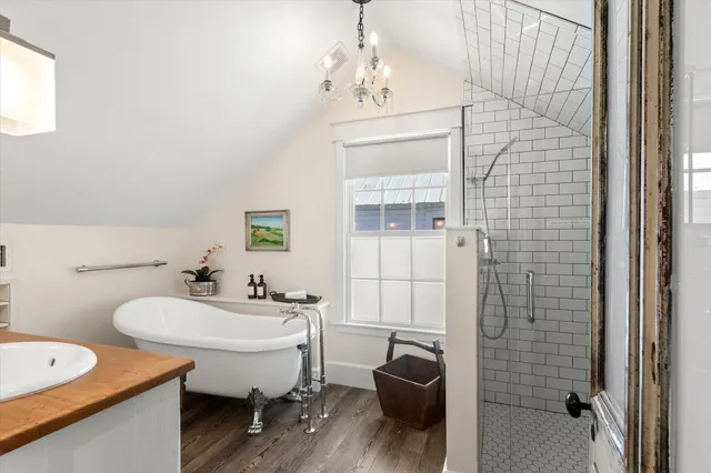 a kitchen with stainless steel appliances a stove a sink and a refrigerator