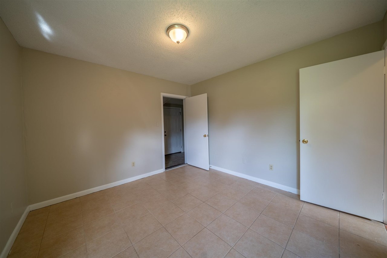 626 Segovia Road St. Augustine, FL 32086 - Photo 18 of 30 an empty room with an empty space and a window