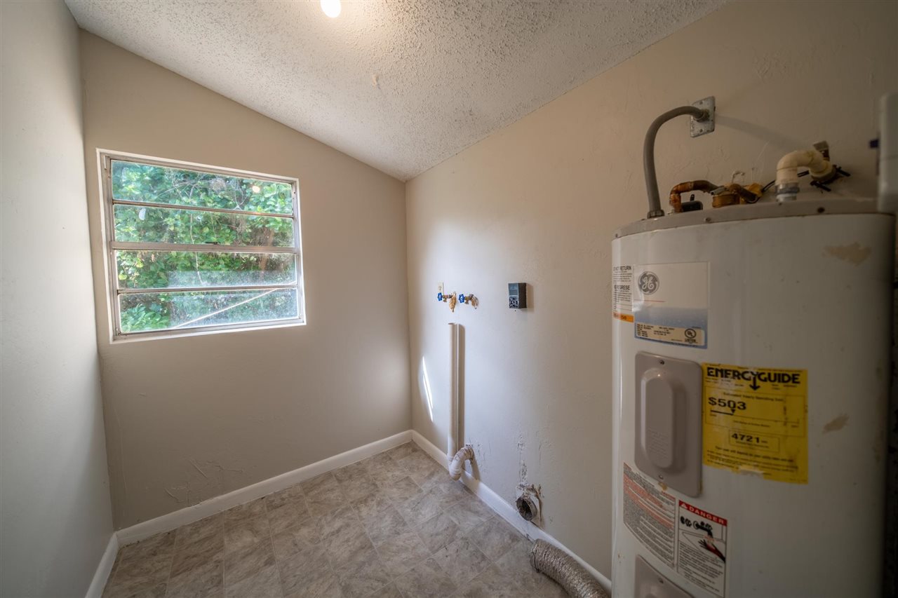 626 Segovia Road St. Augustine, FL 32086 - Photo 21 of 30 a bathroom with a sink and a window
