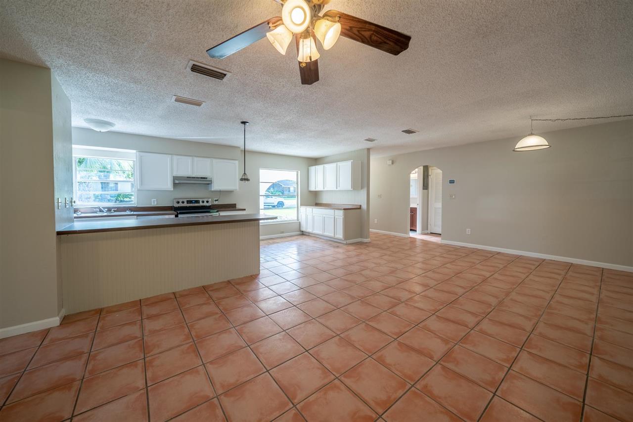 626 Segovia Road St. Augustine, FL 32086 - Photo 6 of 30 a kitchen with stainless steel appliances granite countertop a refrigerator and a stove top oven