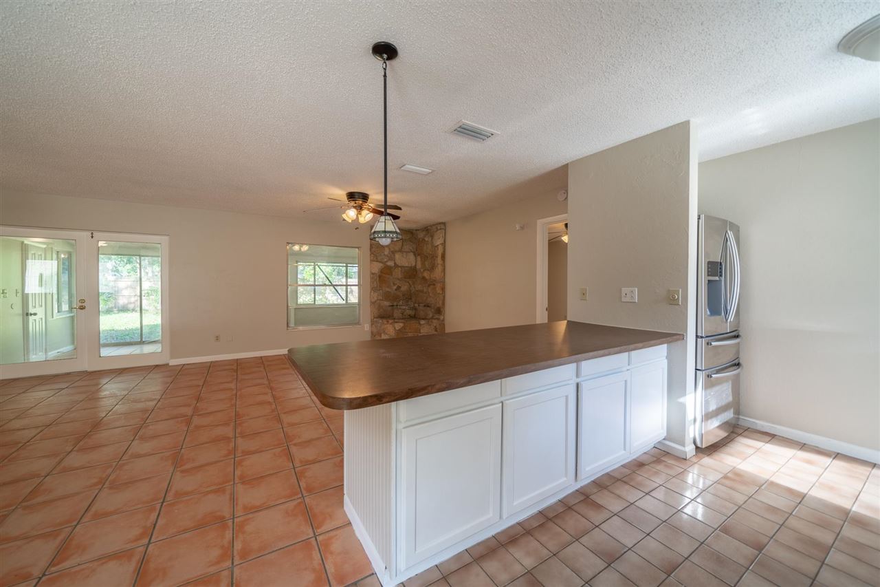 626 Segovia Road St. Augustine, FL 32086 - Photo 8 of 30 a view of a kitchen with granite countertop a sink and dishwasher