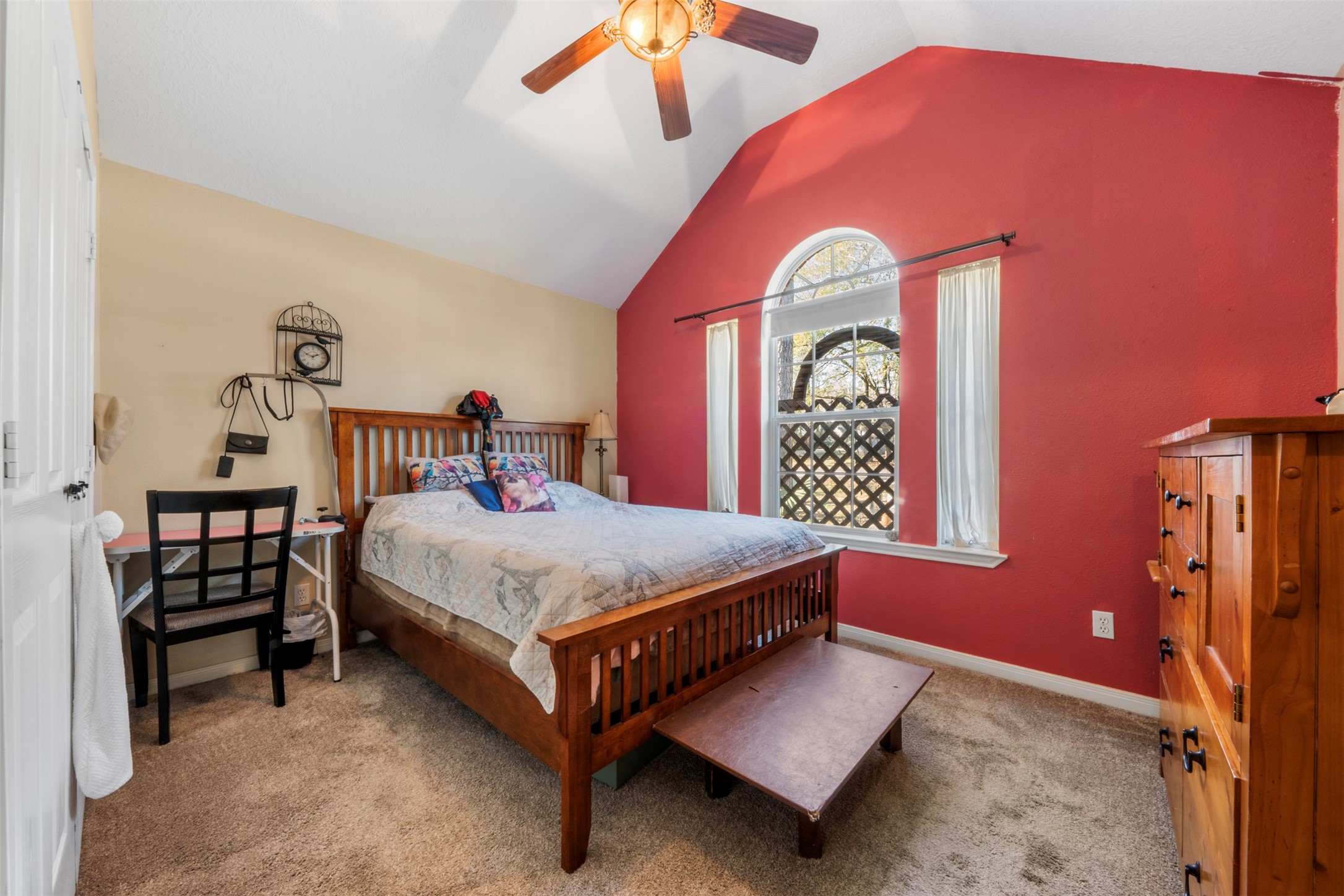 411 Shawnee Conroe, TX 77316 - Photo 14 of 30 a bedroom with a bed and a window