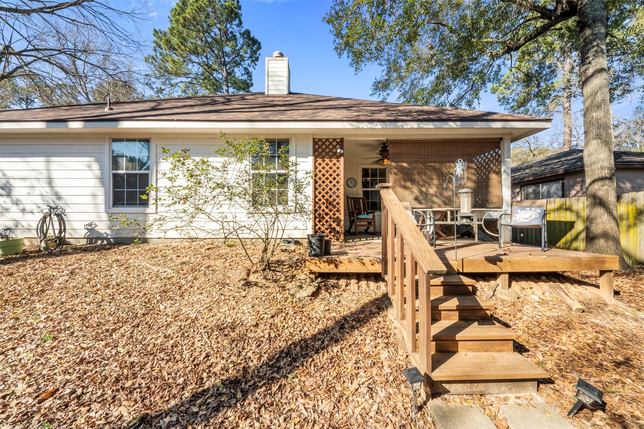 411 Shawnee Conroe, TX 77316 - Photo 21 of 30 a view of a patio with a table and chairs