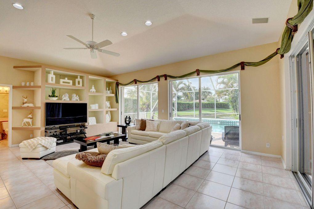 12320 Melrose Way Boca Raton, FL 33428 - Photo 11 of 34 a living room with furniture and a flat screen tv