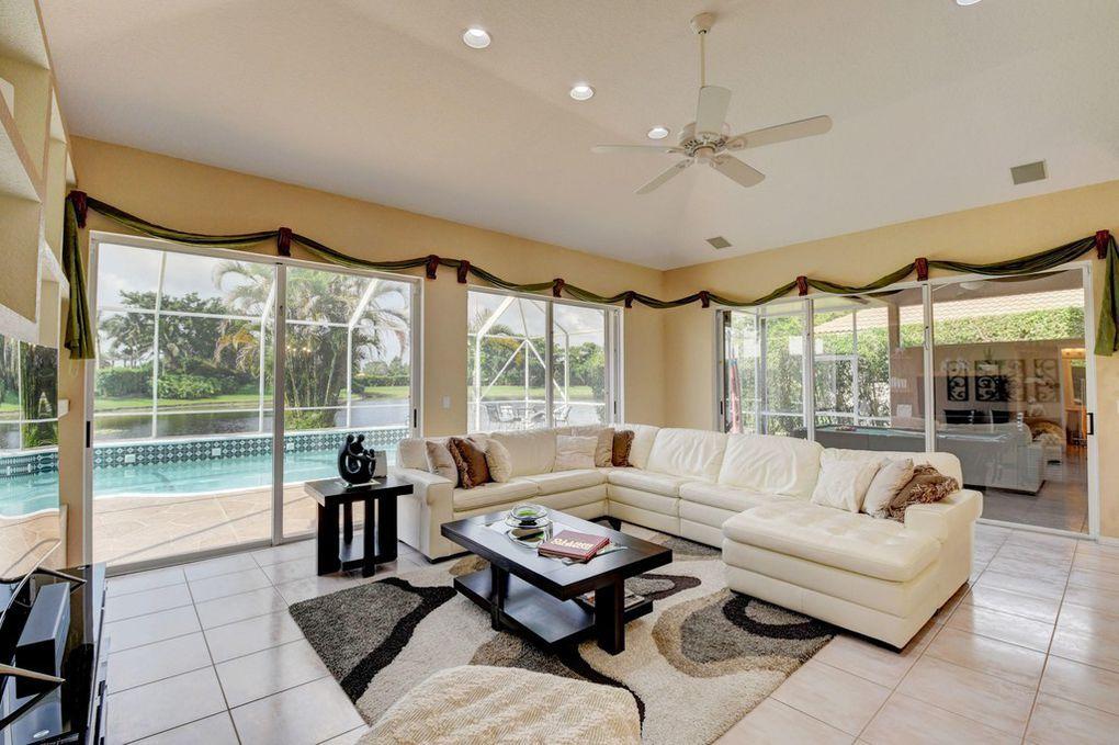 12320 Melrose Way Boca Raton, FL 33428 - Photo 12 of 34 a living room with furniture and a large window