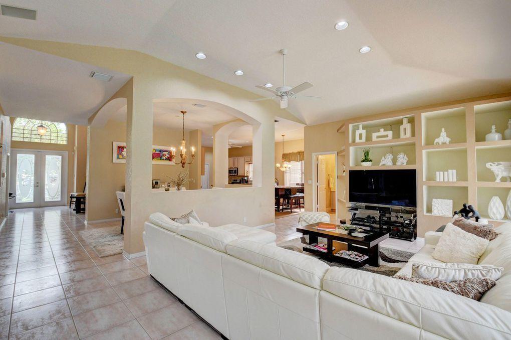 12320 Melrose Way Boca Raton, FL 33428 - Photo 13 of 34 a living room with furniture and a flat screen tv