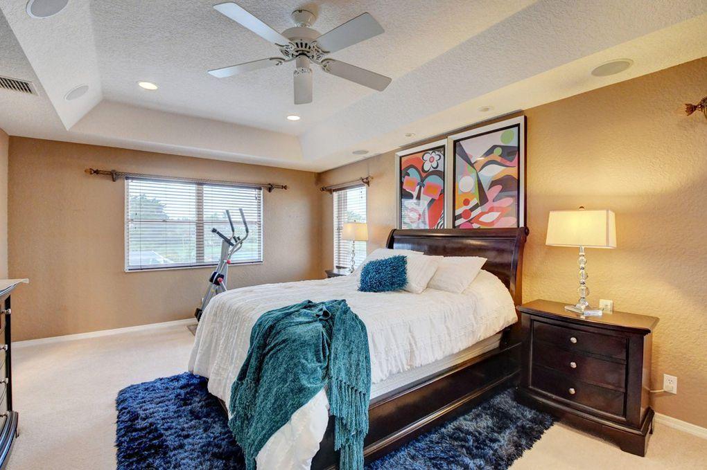 12320 Melrose Way Boca Raton, FL 33428 - Photo 18 of 34 a bedroom with a bed and a window