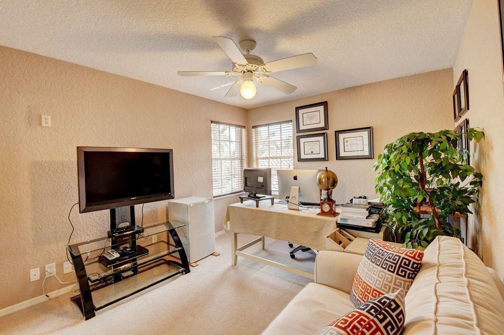 12320 Melrose Way Boca Raton, FL 33428 - Photo 22 of 34 a living room with furniture and a flat screen tv