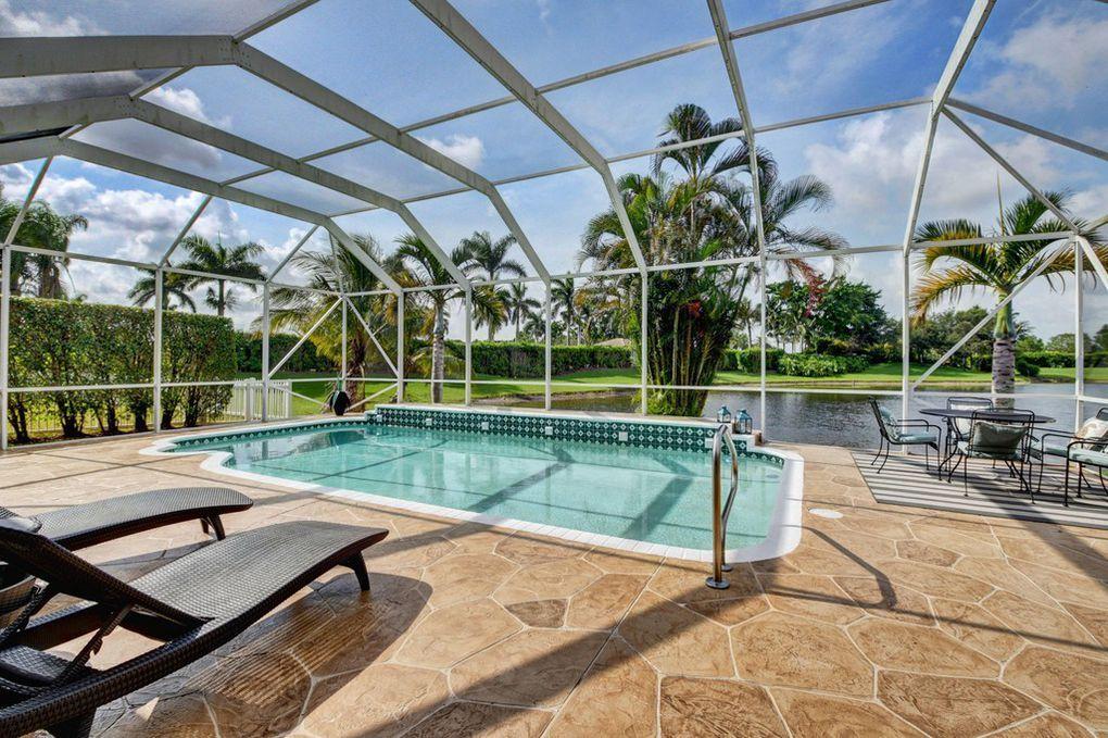 12320 Melrose Way Boca Raton, FL 33428 - Photo 25 of 34 a view of a swimming pool with a patio