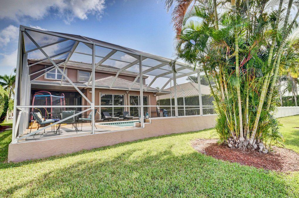 12320 Melrose Way Boca Raton, FL 33428 - Photo 28 of 34 front view of a house with a yard