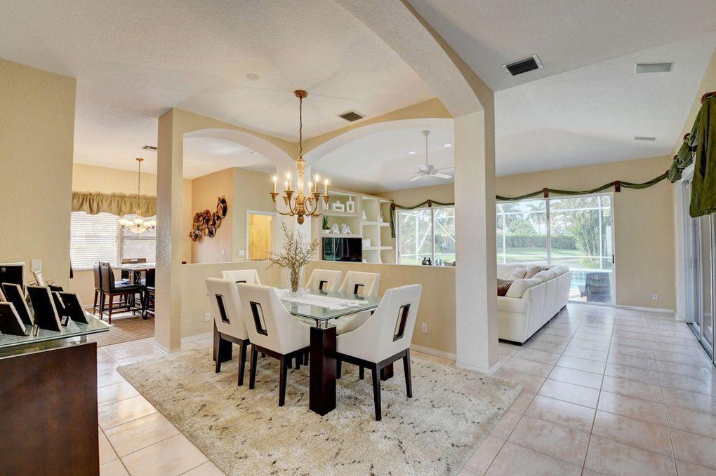 12320 Melrose Way Boca Raton, FL 33428 - Photo 7 of 34 a dining room with furniture a chandelier and window