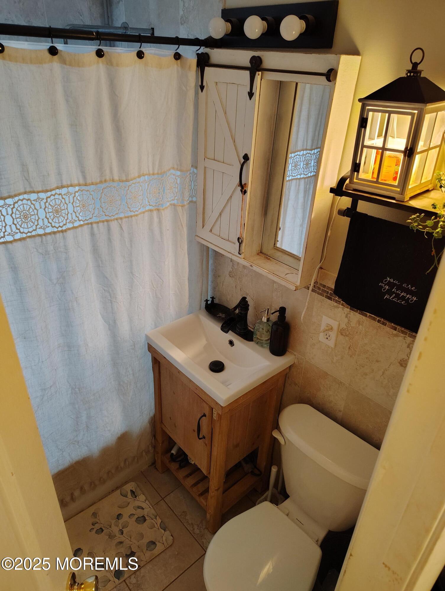 434 Shady Lane Howell, NJ 07731 - Photo 15 of 15 a bathroom with a sink toilet and shower