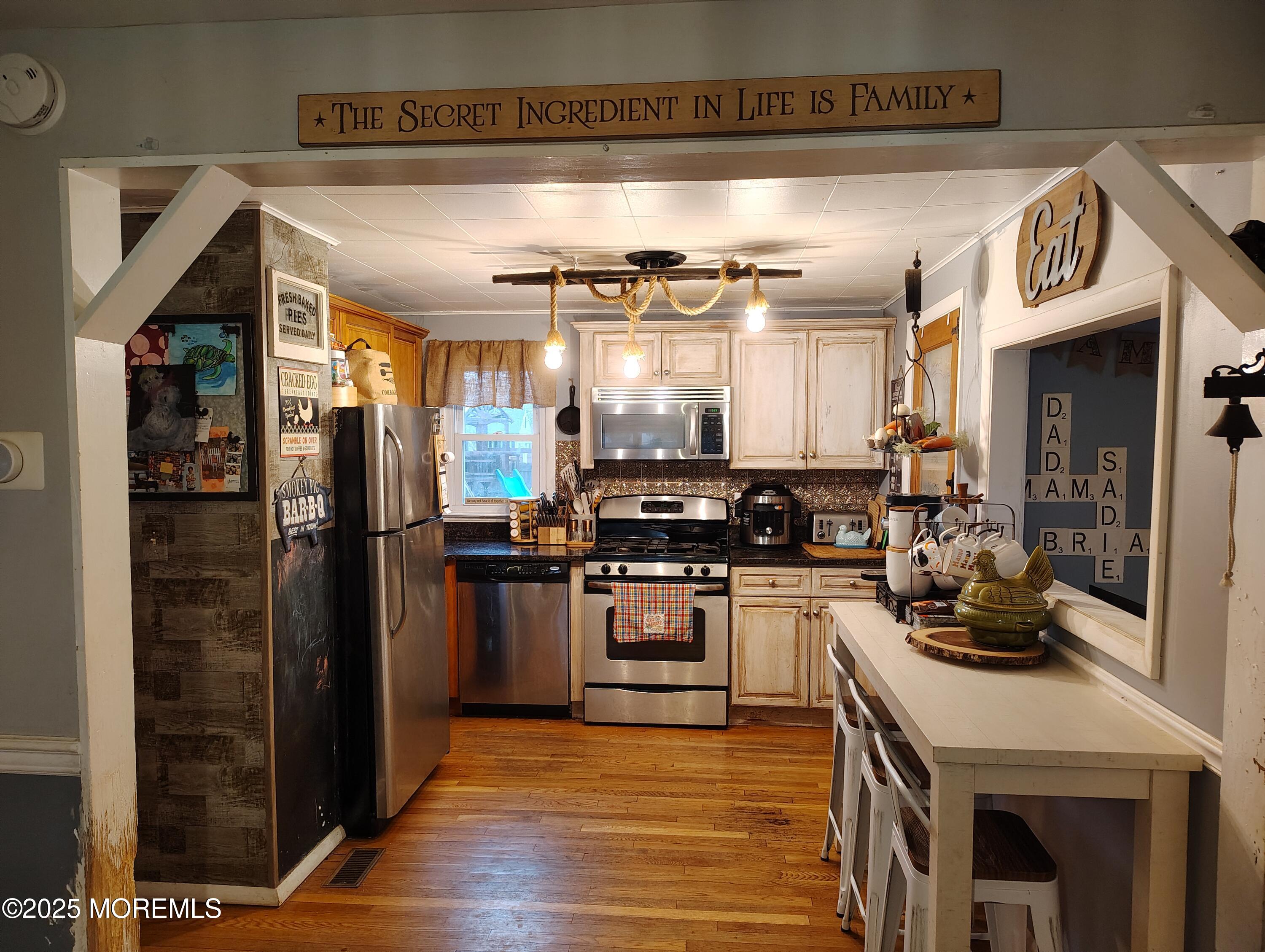 434 Shady Lane Howell, NJ 07731 - Photo 2 of 15 a kitchen with a refrigerator and a stove