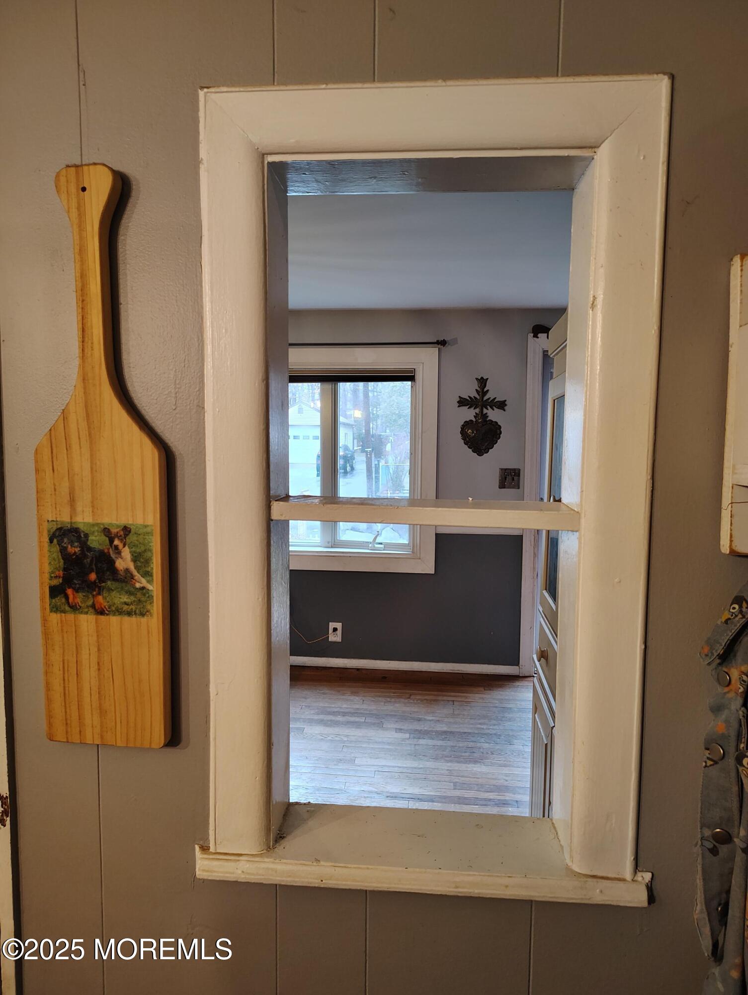434 Shady Lane Howell, NJ 07731 - Photo 7 of 15 a view of a hallway with wooden floor and a cabinet