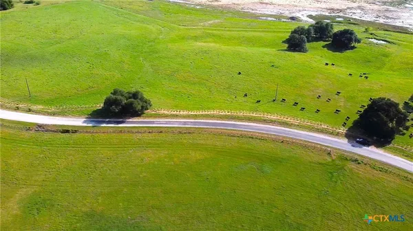 a view of a pool with a yard