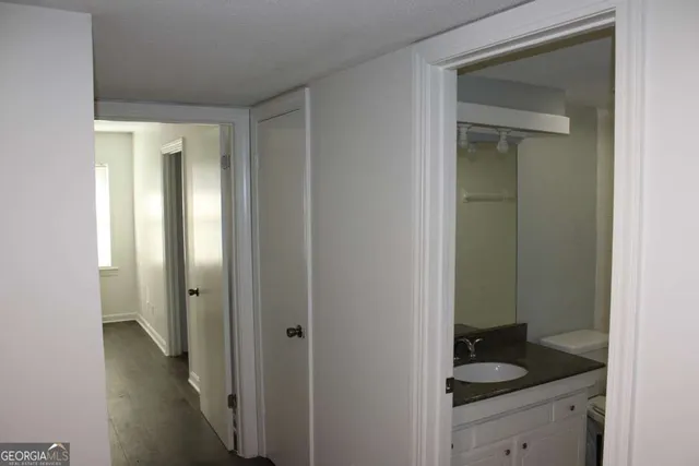 a view of a bathroom from a hallway